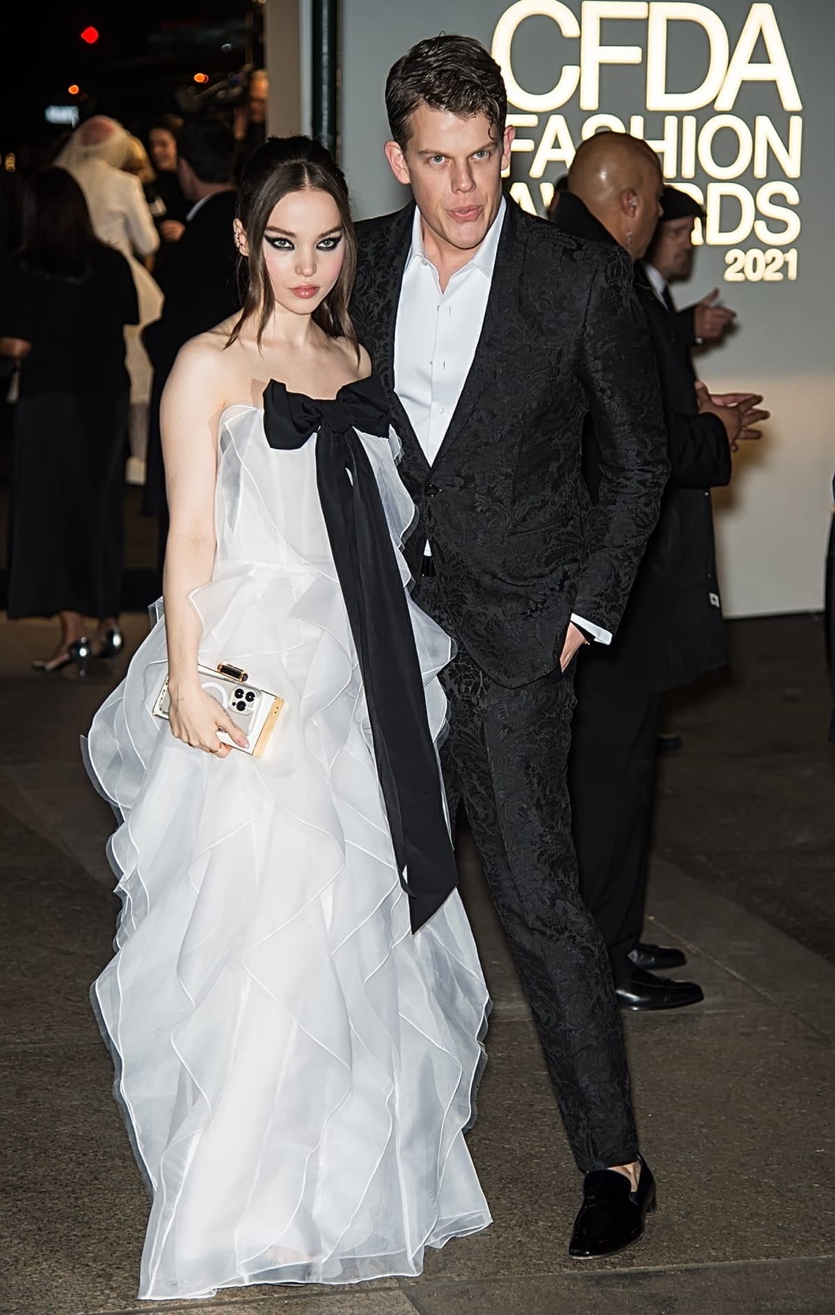 Dove Cameron in a Carolina Herrera off-the-shoulder dress with fashion designer Wes Gordon at the 2021 CFDA Fashion Awards