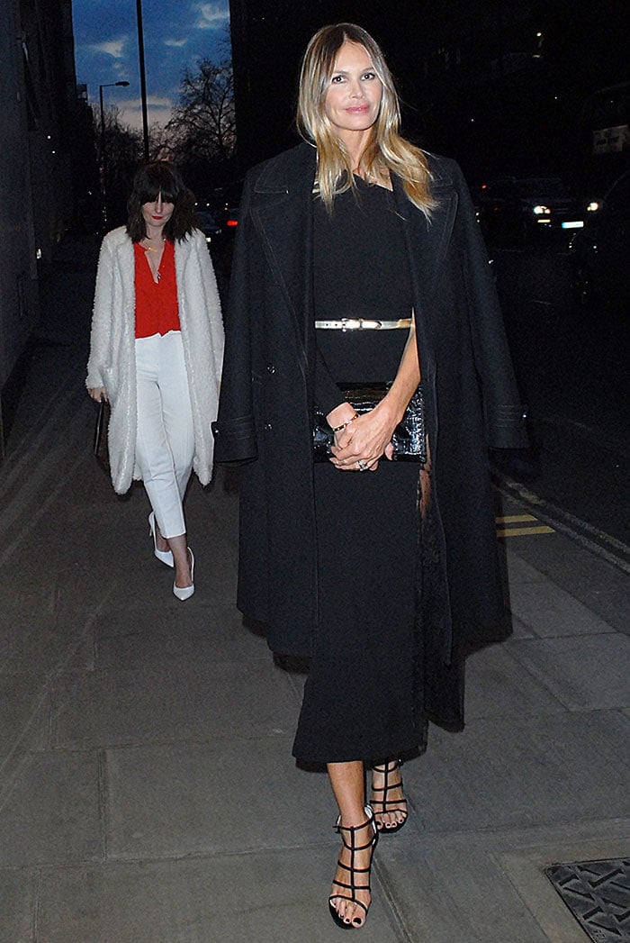 Elle Macpherson wears a one-shouldered gown as she arrives at a London hotel