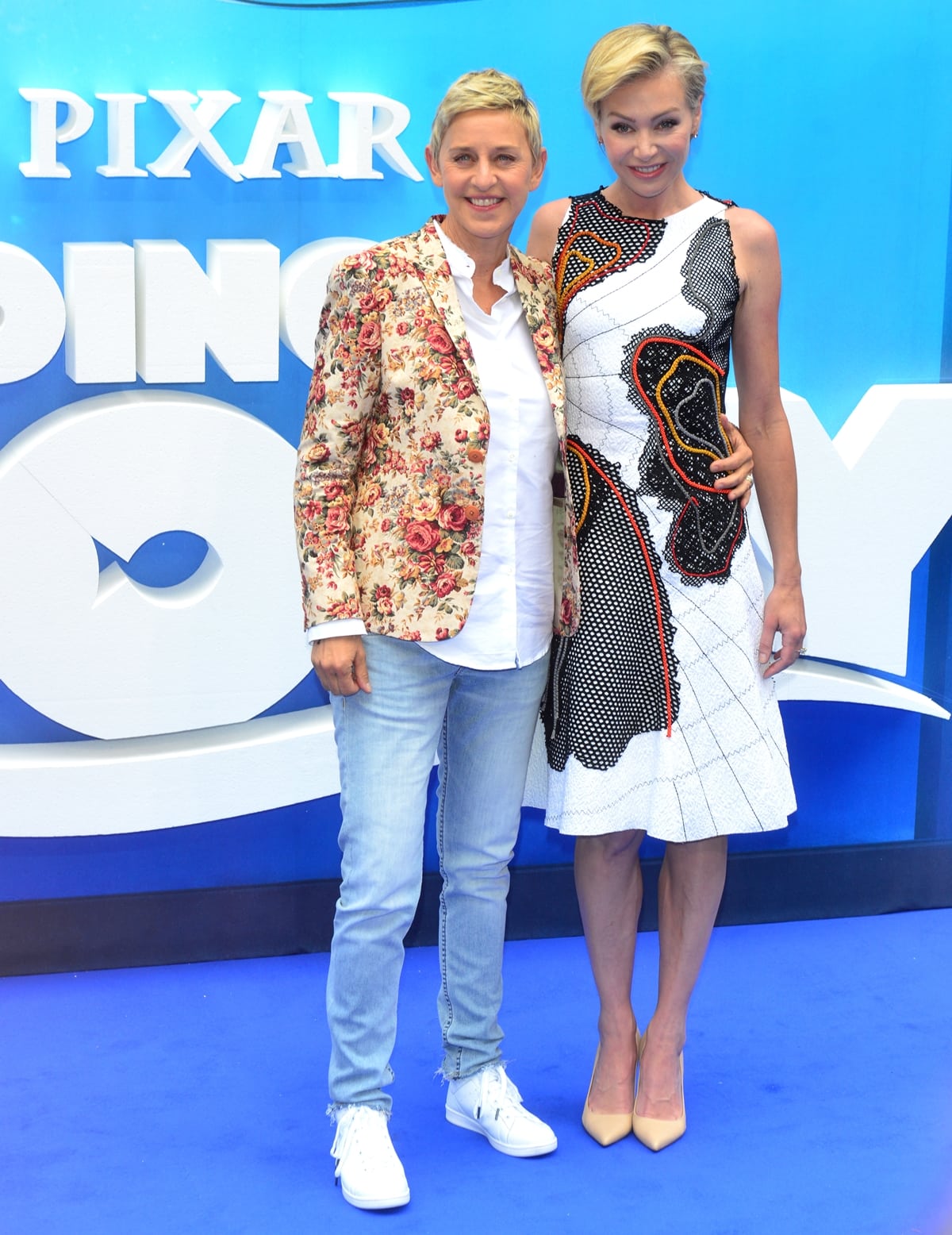 Ellen DeGeneres and her wife Portia de Rossi pose for photos at the Finding Dory premiere