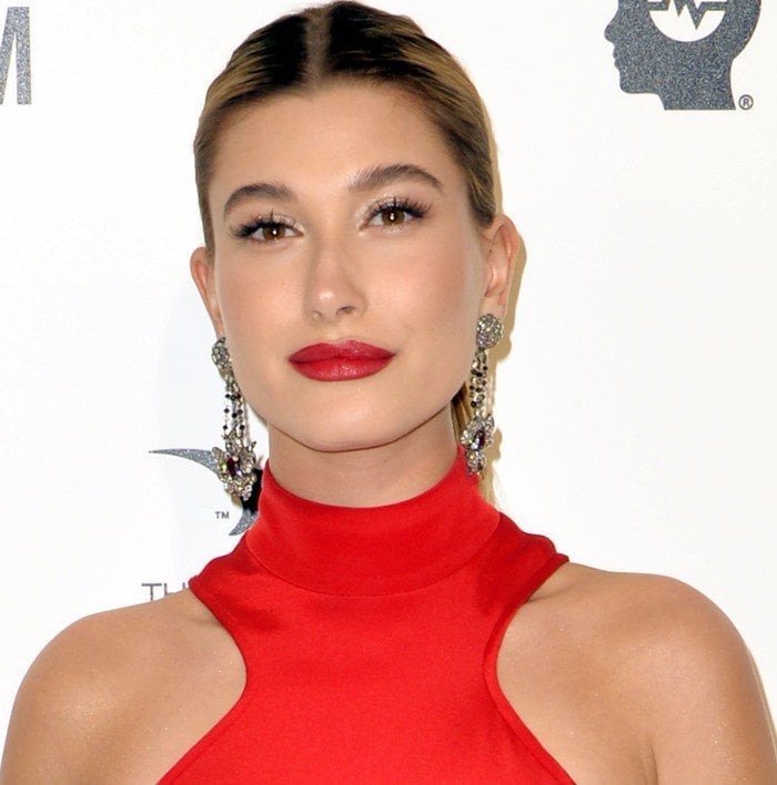 Hailey Baldwin wears her hair back at the 2016 Elton John AIDS Foundation’s Oscar Viewing Party