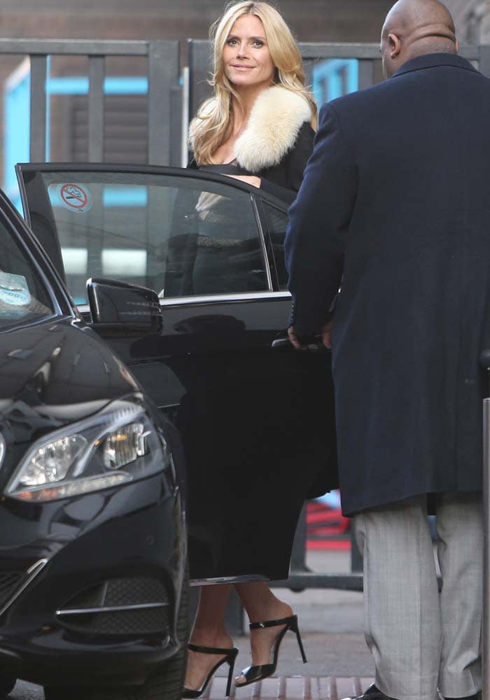 Heidi Klum greets the paparazzi as she exits ITV Studios