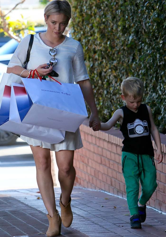 Hilary Duff shops with her son Luca at Fred Segal in Los Angeles on February 25, 2016