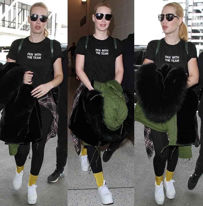 Iggy Azalea promotes her new single "Team" with a black shirt and leggings