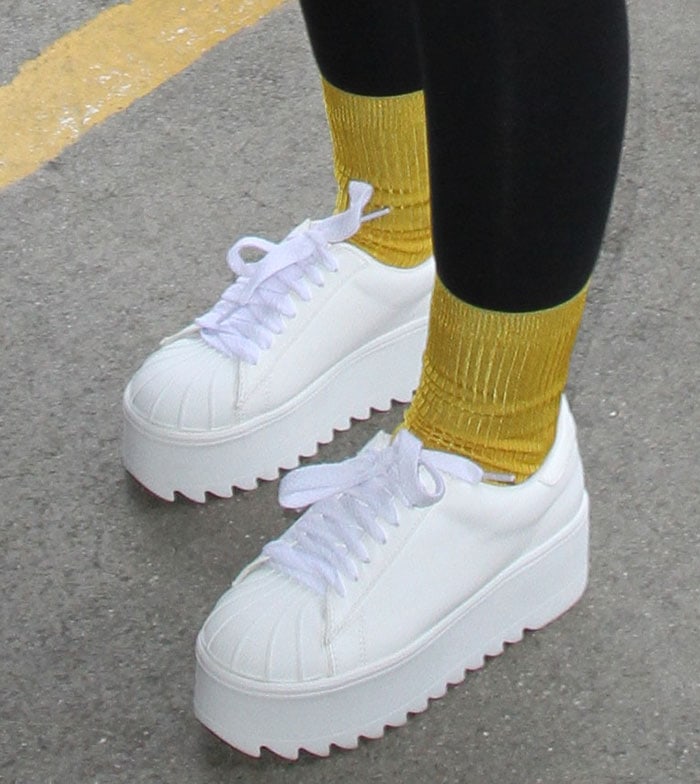 Iggy Azalea boosts her height with white platform sneakers