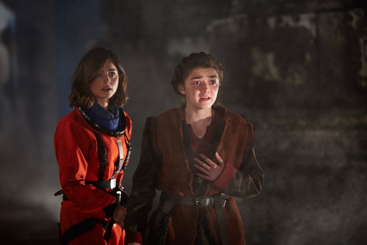 Jenna Coleman as Clara Oswald and Maisie Williams as Ashildr (also known as Me) in the British science fiction television series Doctor Who