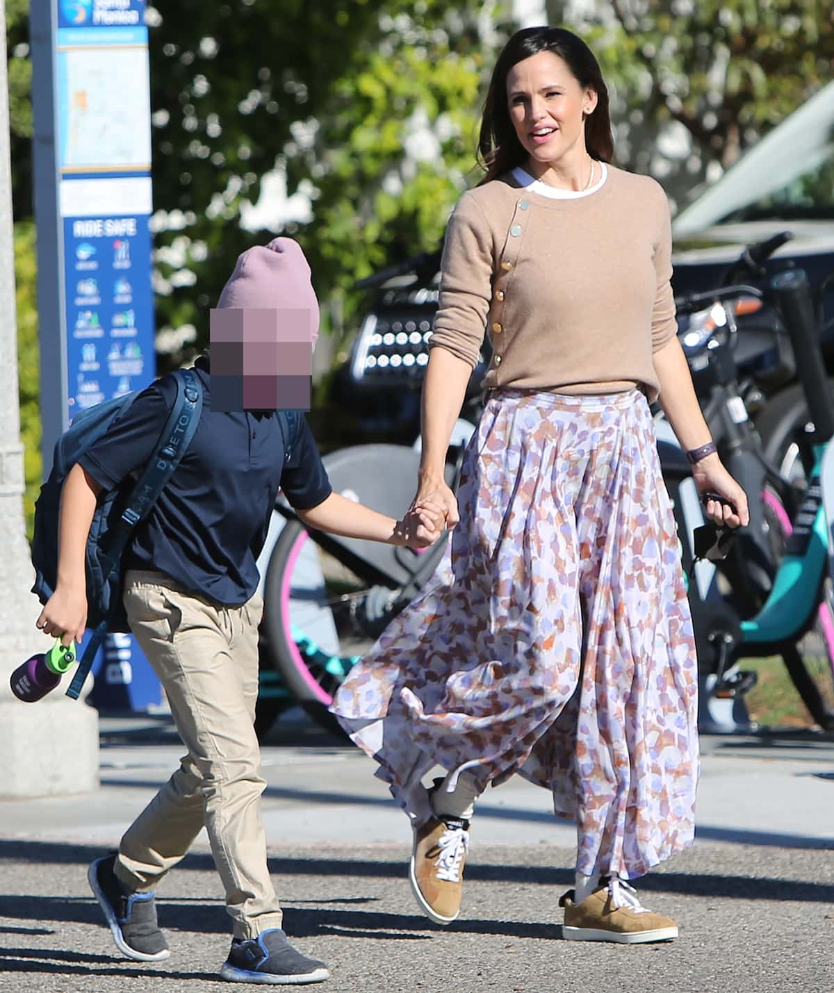 Wearing Altuzarra's beige Minamoto button-embellished cashmere sweater with a French Riviera long skirt by LHD and Chanel suede calfskin sneakers, Jennifer Garner holds hands with her son Samuel Affleck in Santa Monica on October 26, 2021