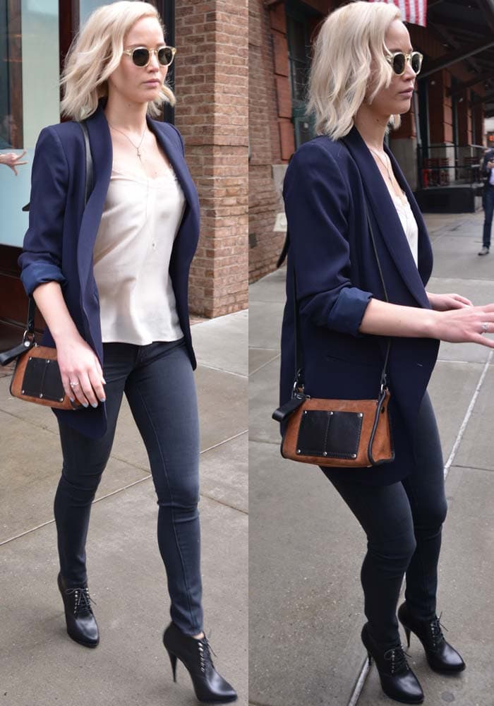 Jennifer Lawrence wears a more formal blazer-and-jeans look for her DVD promotion tour