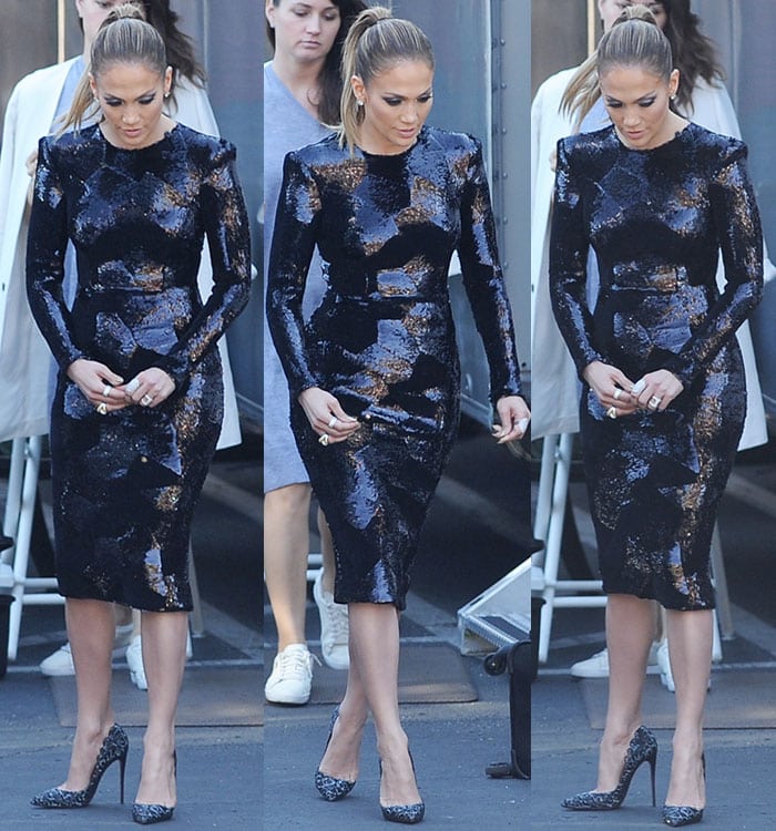 Jennifer Lopez shows off the '80s-inspired padded shoulders on her Alex Perry dress