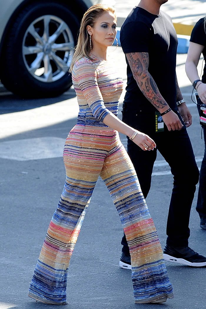 Jennifer Lopez stuns in a bold, figure-hugging, multicolored striped jumpsuit as she arrives for the "American Idol Finale" in Los Angeles
