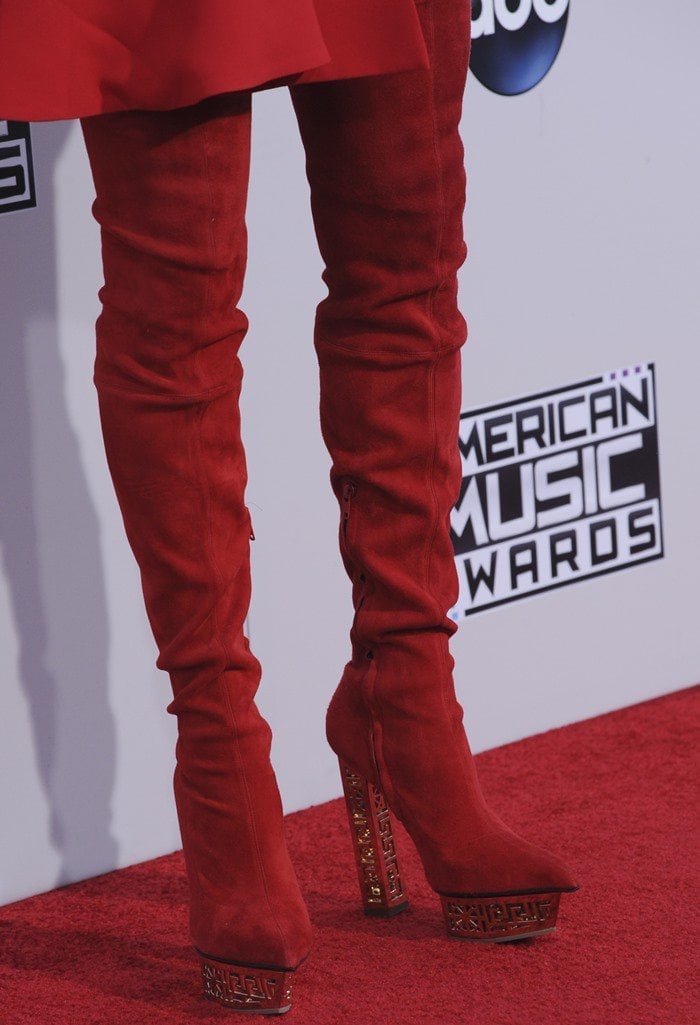 Jenny McCarthy in red stretch suede Versace over-the-knee boots