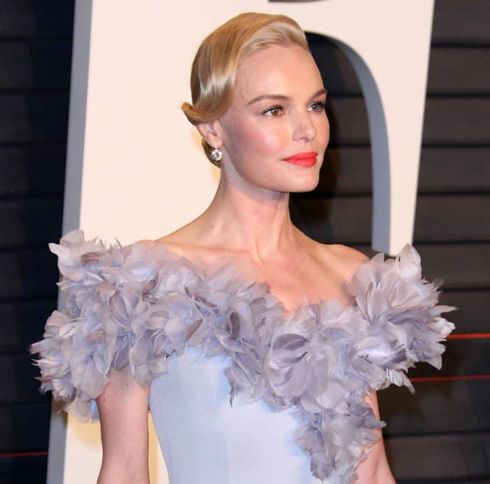 Kate Bosworth styled her hair in a sleek bun with a side-swept bang and opted for a colored lip at the Vanity Fair Oscar Party 2016