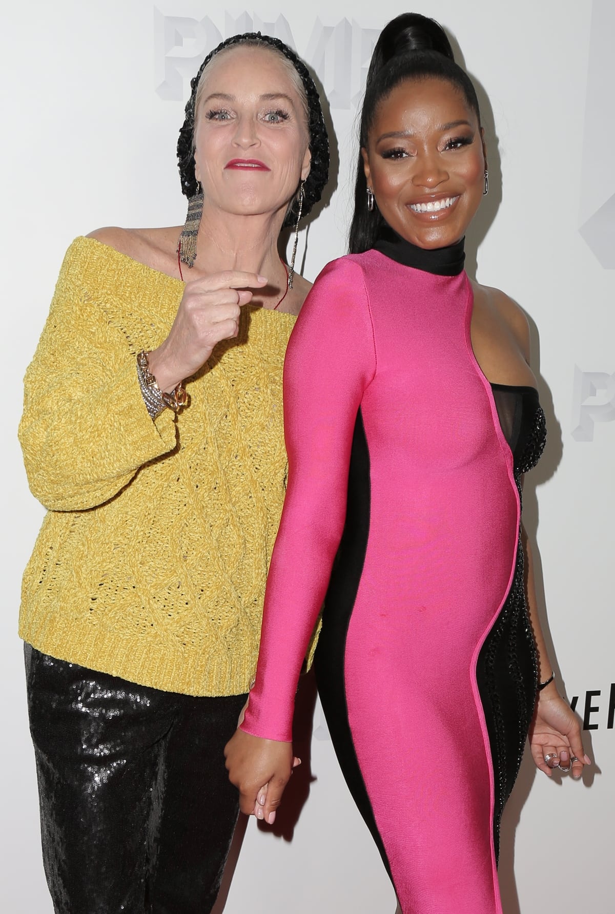Keke Palmer in a pink and black dress with Sharon Stone at the premiere of Vertical Entertainment's "Pimp"