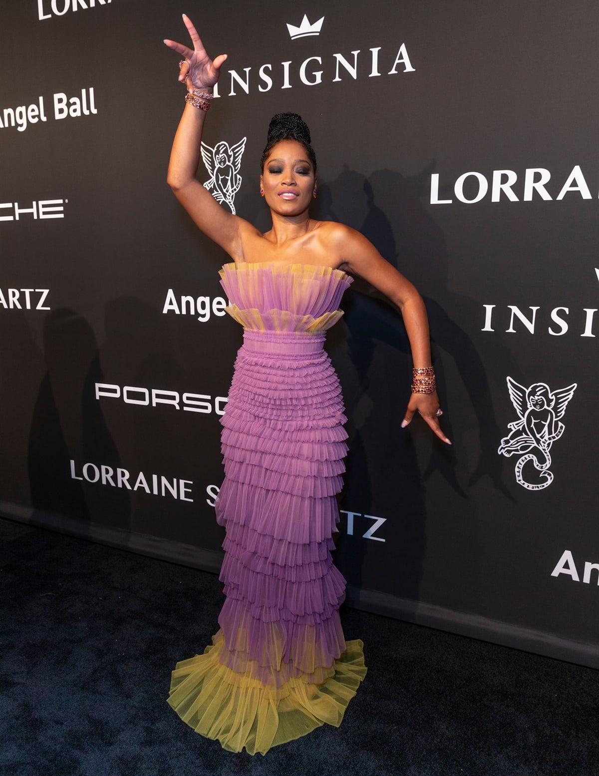 Keke Palmer wears a purple and yellow J. Mendel Spring 2020 gown and Lorraine Schwartz jewelry while attending the Gabrielle’s Angel Foundation 2019 Angel Ball