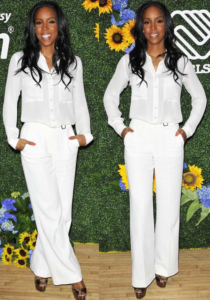 Kelly Rowland wears a white button-down shirt paired with white pants