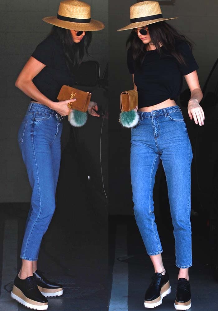 Kendall Jenner shows off her midriff in a pair of REdone jeans