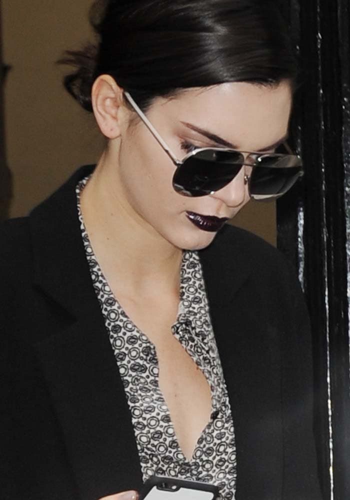 Kendall Jenner wears her hair back as she leaves the Dior show held during Paris Fashion Week