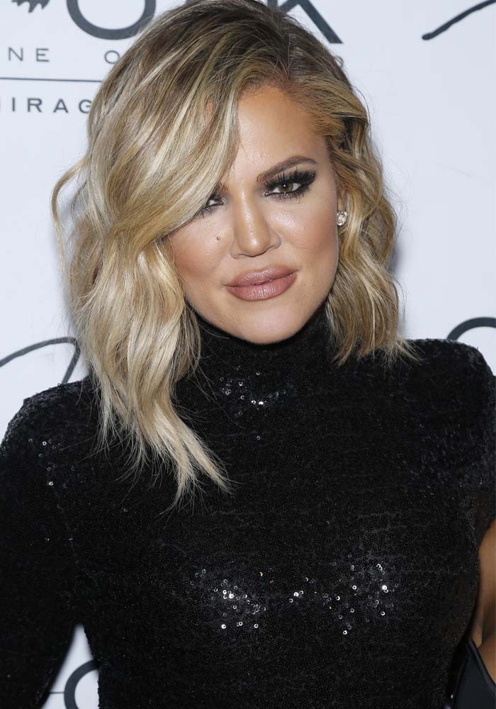 Khloe Kardashian wears her hair down at 1 OAK Nightclub located inside The Mirage