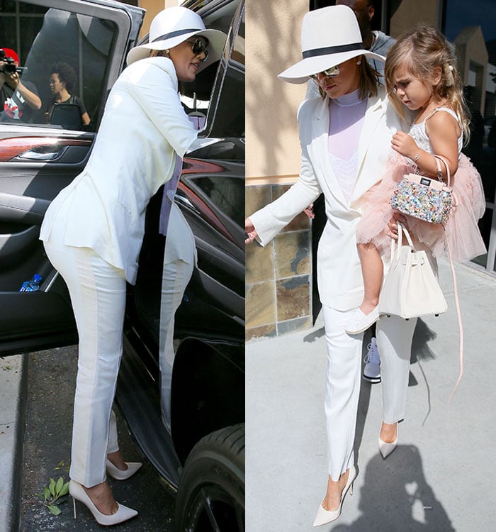 Khloe Kardashian carries her daughter Penelope as she arrives at church