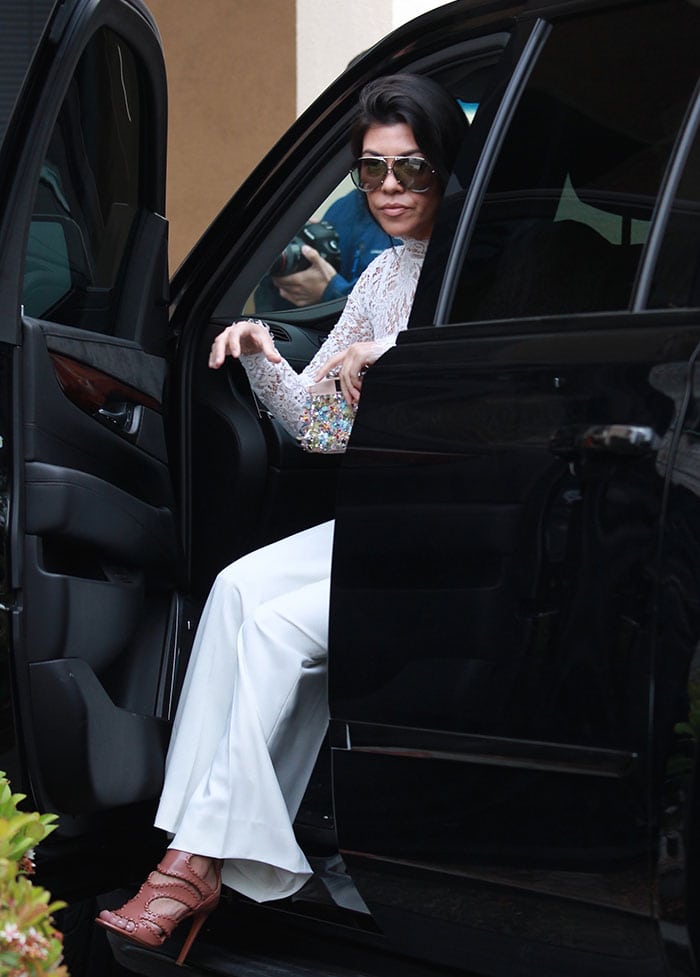 Kourtney Kardashian wears an all-white ensemble as she arrives for Easter Sunday services at California Community Church