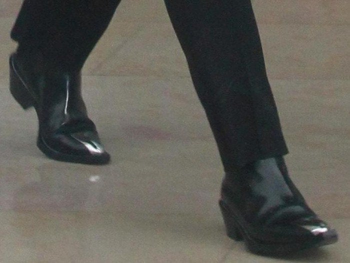 Kris Jenner wears classic black boots in Paris