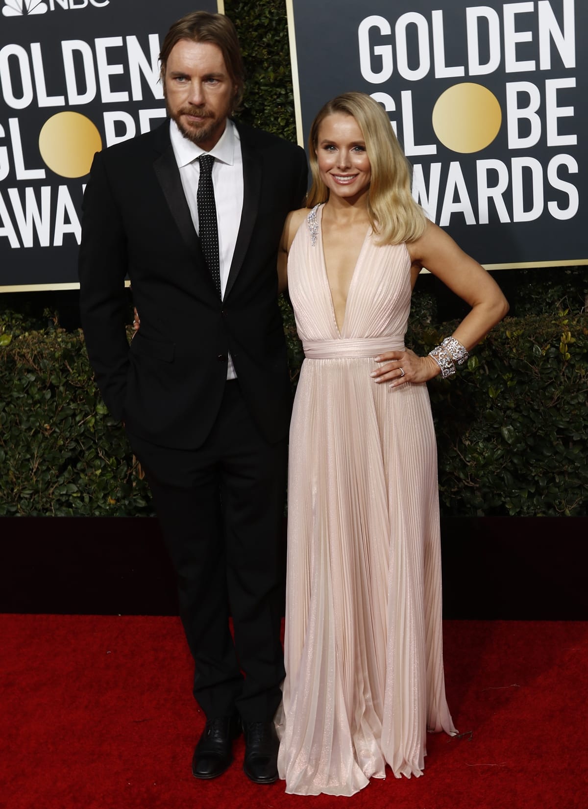 Kristen Bell in a Zuhair Murad dress and her husband Dax Shepard in Dolce & Gabbana on the red carpet at the 2019 Golden Globe Awards