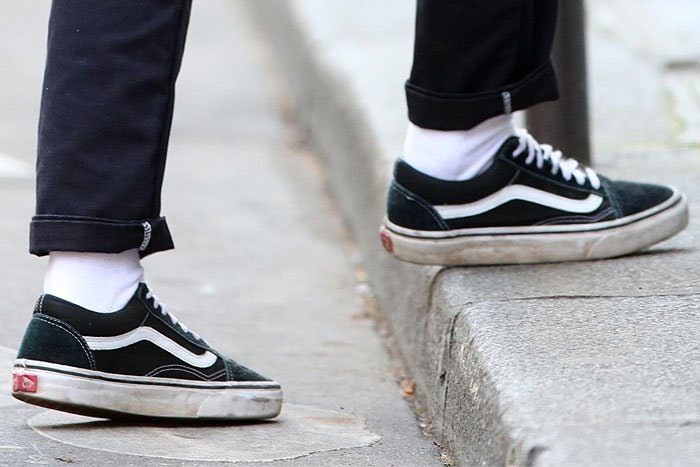 Kristen Stewart's dirty and beat-up black Vans 'Old Skool' sneakers 