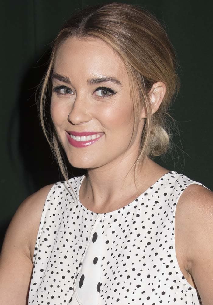 Lauren Conrad clips her hair back at the signing of her new book "Celebrate"