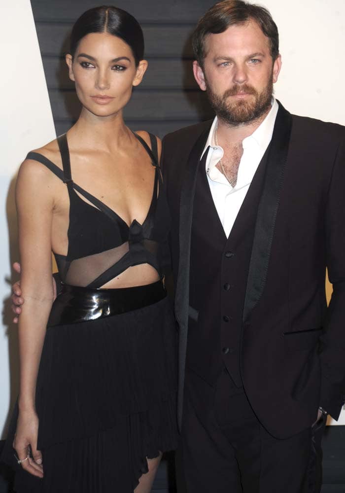 Lily Aldridge and husband Caleb Followill pose for photos on the red carpet