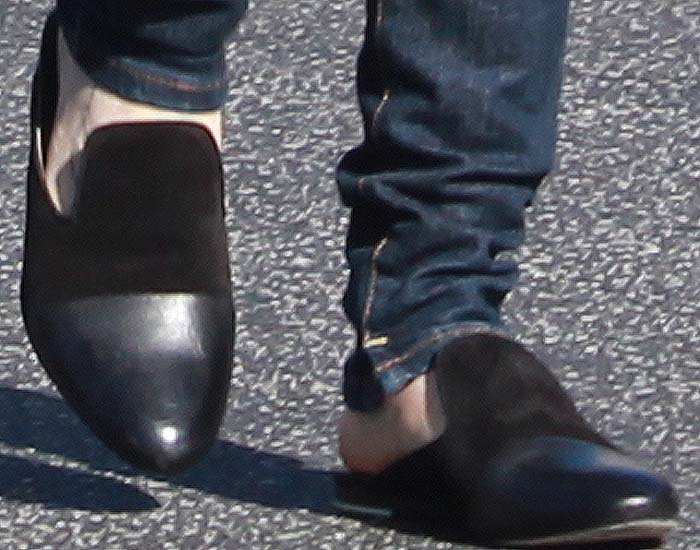 Lily Collins steps out in Rag & Bone's Sabine’ slip-on shoes featuring a sleek black leather and suede combo with a backless mule design for effortless sophistication and comfort