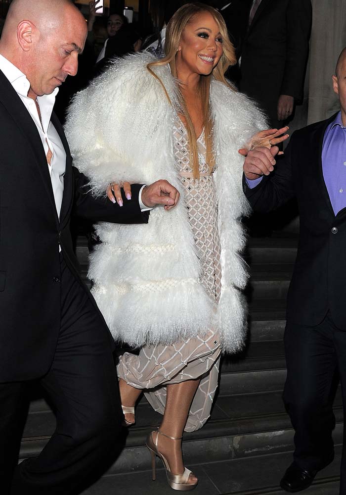 Mariah Carey wearing Temperley London's Alika dress underneath a gigantic white fur coat