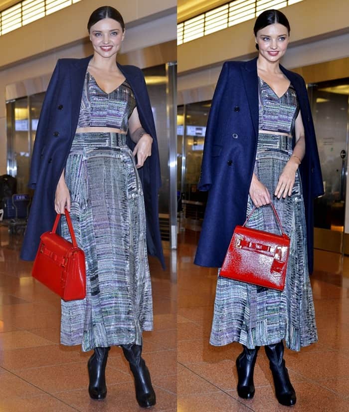 Miranda Kerr turns heads in a textured two-piece dress, navy coat, black leather boots, and a bold red Samantha Thavasa Chouchou bag while arriving in Tokyo on December 11, 2015
