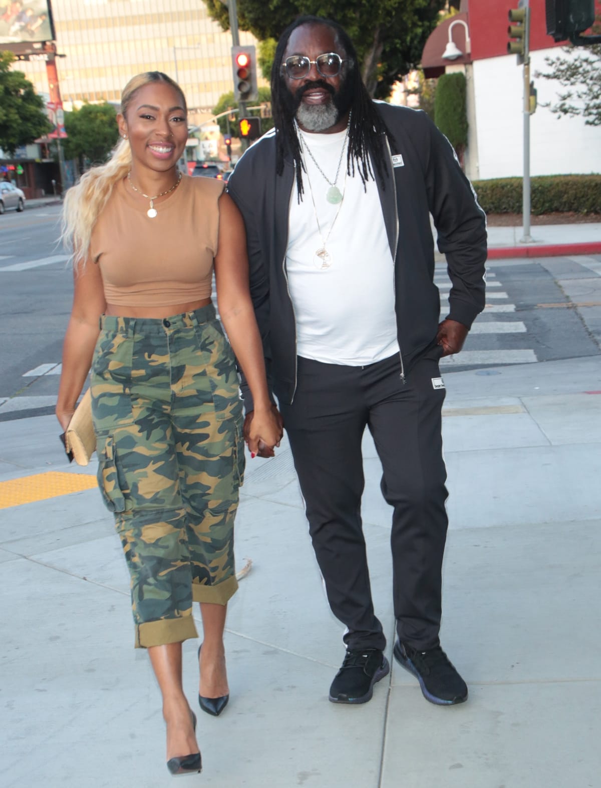 Niki McElroy and Kazembe Ajamu Coleman holding hands in Los Angeles