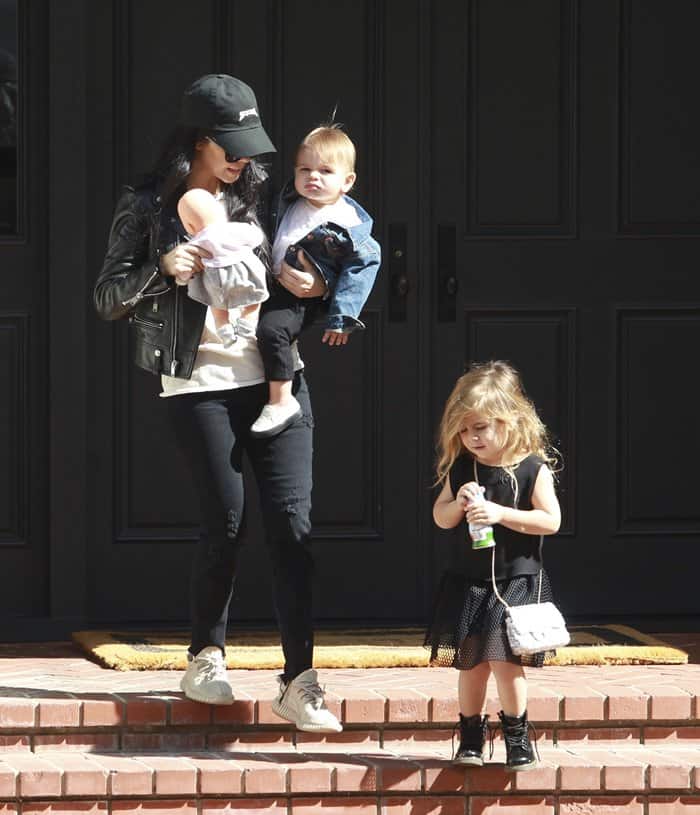 Kourtney Kardashian with Penelope Disick and Reign Disick on the way to singing class on February 18, 2016