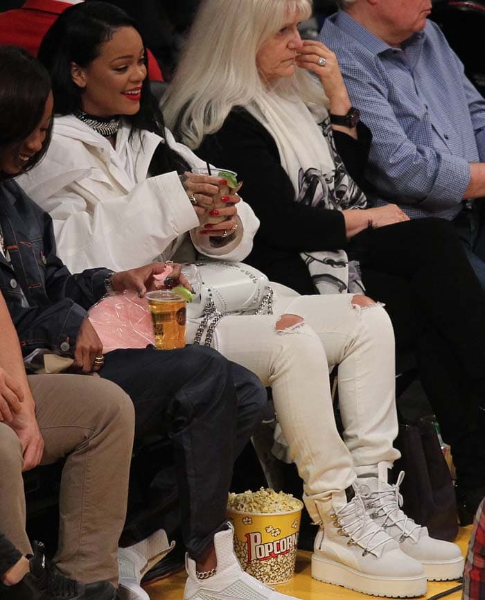 Rihanna wears an all-white ensemble at a recent LA Lakers game