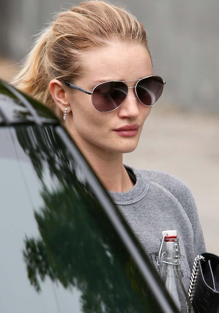 Rosie Huntington-Whiteley keeps her hair up as she leaves a Los Angeles gym