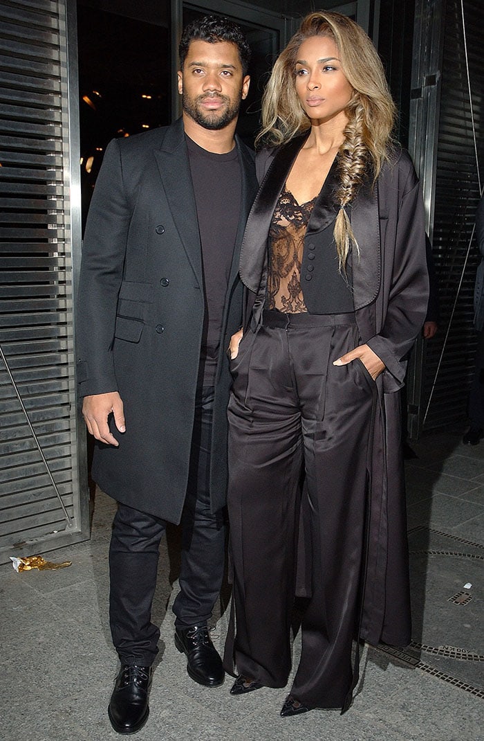 Russell Wilson and Ciara pose for photos at the Givenchy fashion show