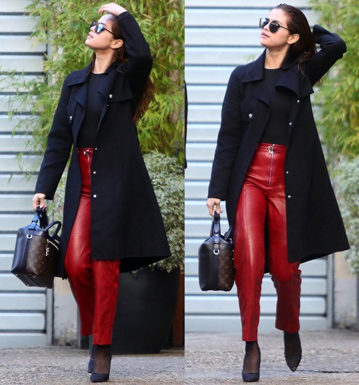 Selena Gomez wears a pair of red Louis Vuitton pants