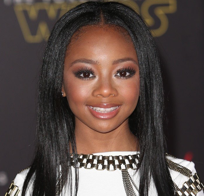 Skai Jackson beams in a chic white dress, capturing hearts at the 'Star Wars: The Force Awakens' premiere