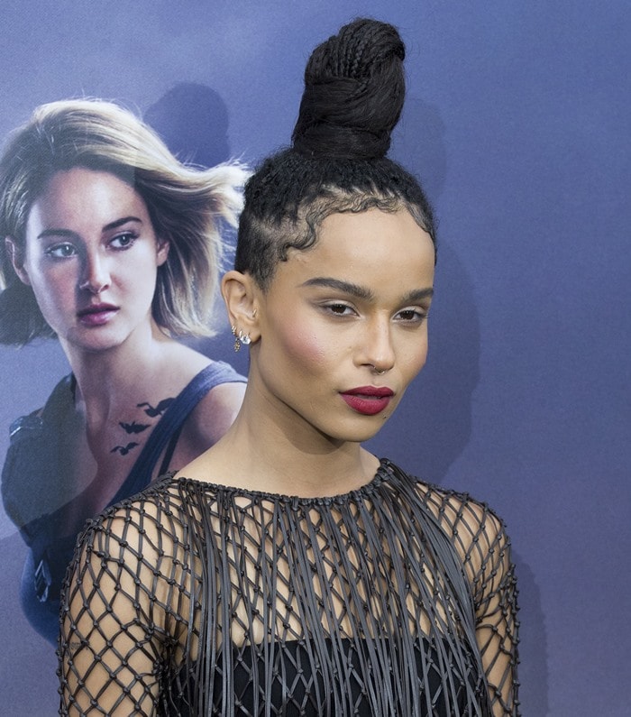 Zoë Kravitz wears a strapless romper under a fishnet-and-fringe dress