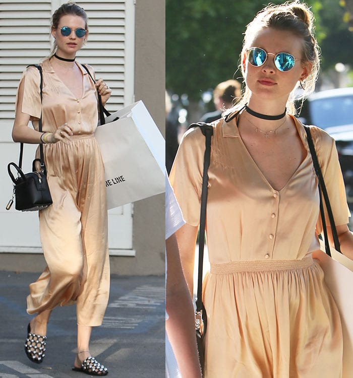 Behati Prinsloo wears a silky maxi dress while shopping on Melrose Place