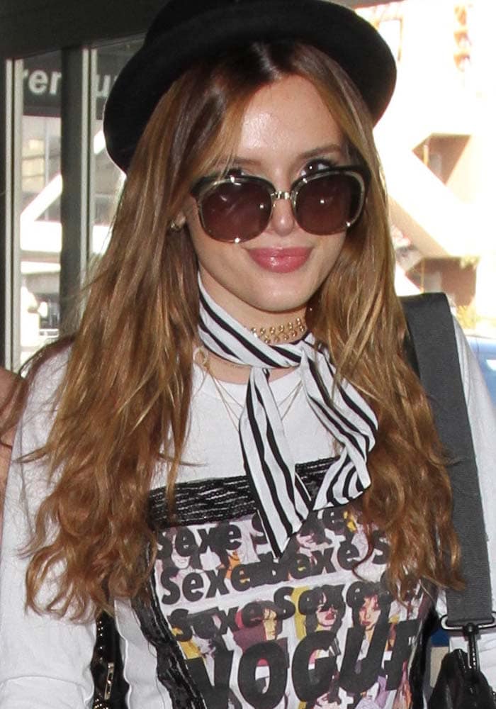 Bella Thorne leaves her hair down as she prepares to depart Los Angeles International Airport