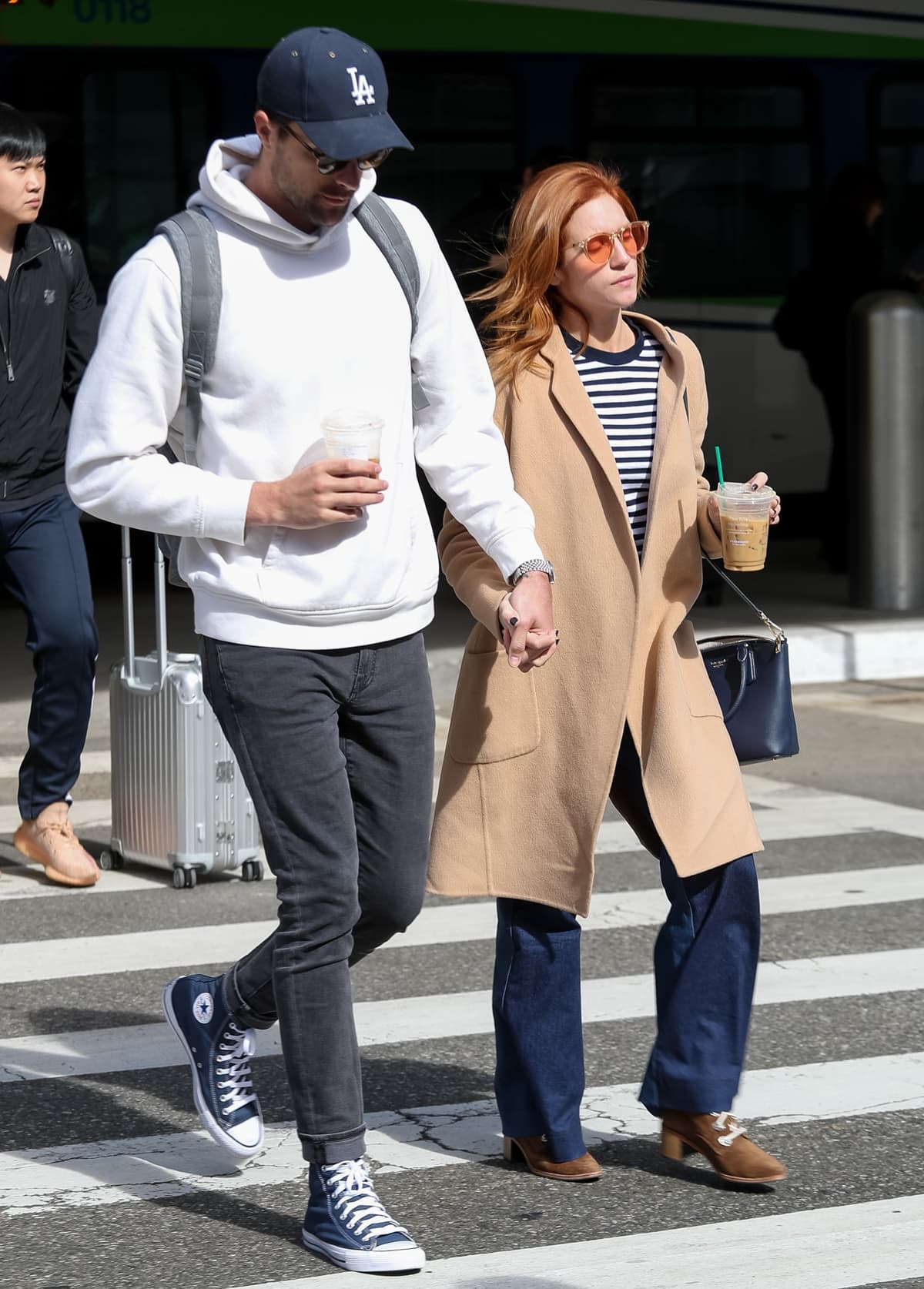 Brittany Snow and her fiancé Tyler Stanaland are seen at Los Angeles International Airport (LAX)