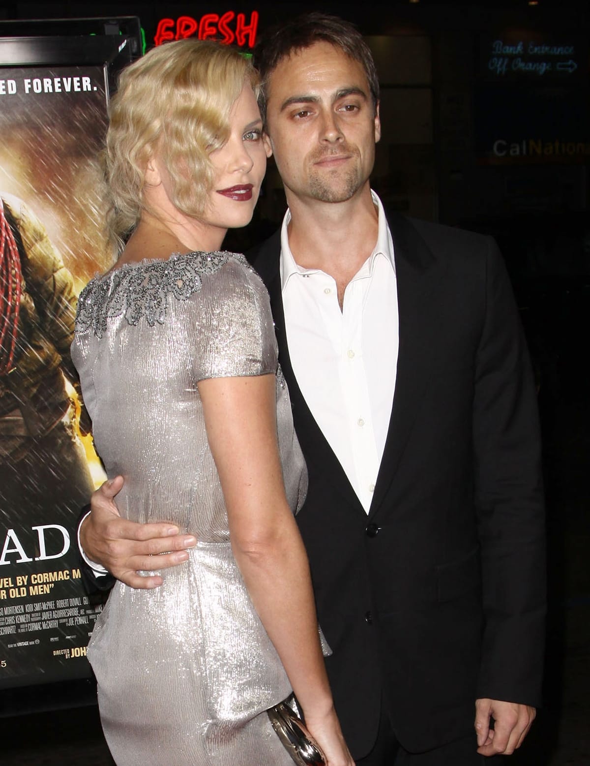Charlize Theron is three years younger and one inch shorter than Stuart Townsend
