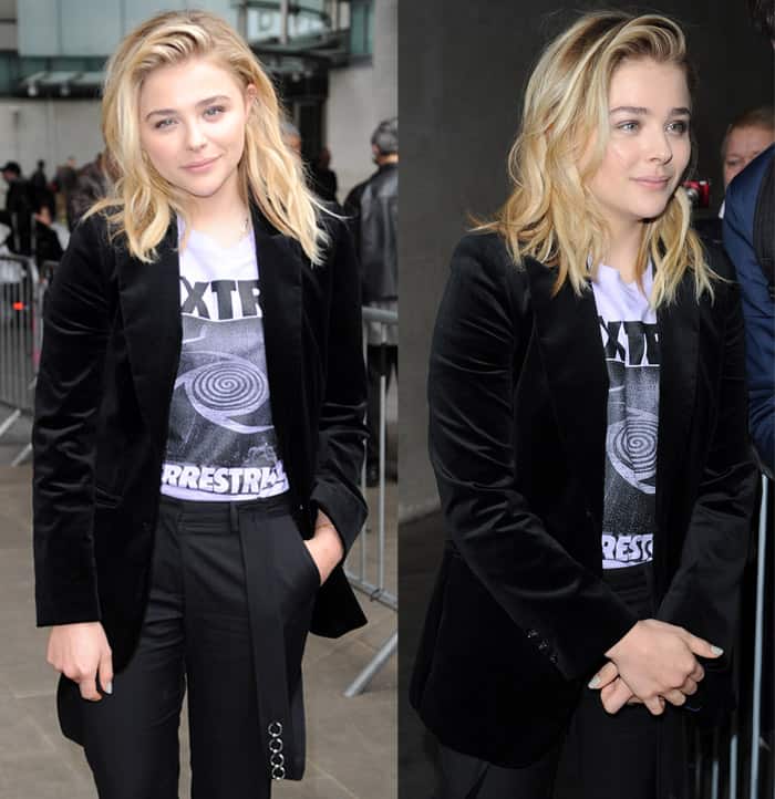 Chloë Grace Moretz stands out with her bold extraterrestrial graphic t-shirt, perfectly paired with chic pants and a sleek black jacket