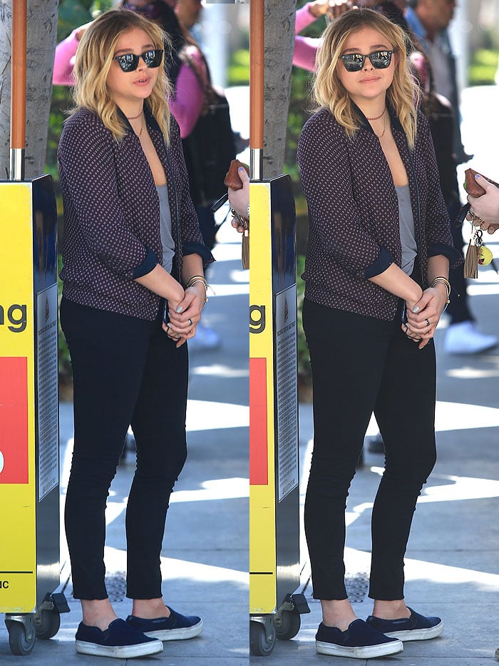 Chloe Moretz wears a bomber jacket and skinny jeans while out for lunch in Beverly Hills