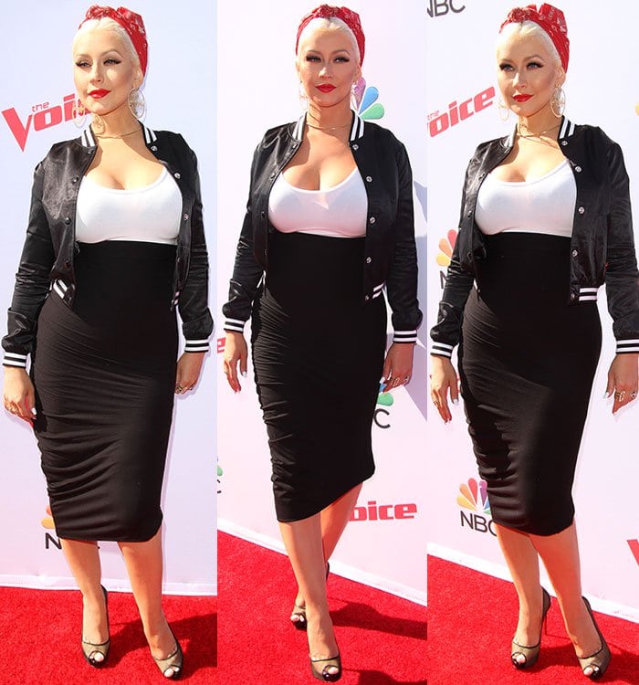 Christina Aguilera wears a white tank top and high-rise fitted pencil skirt