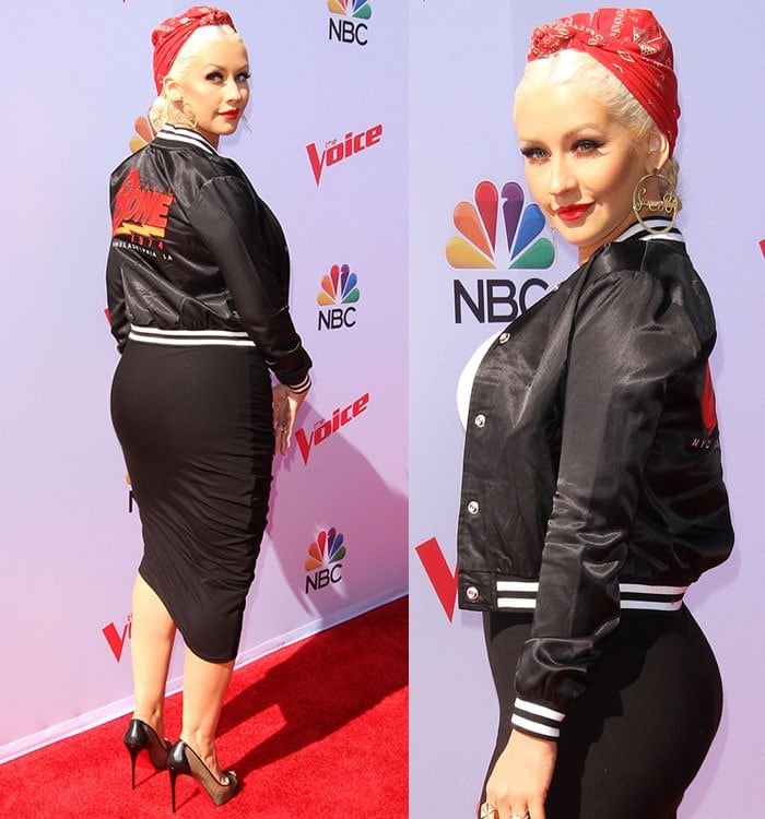 Christina Aguilera covers her hair with a bandana and flaunts her curves in a tight black skirt and black bomber jacket