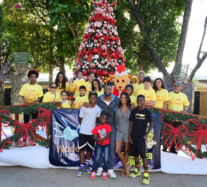 Dada Wade, Dwyane Wade, Zion Wade, Gabrielle Union, and Zaire Wade attend a fun-filled day at Santa's Enchanted Forest for Wade's World Foundation 'Under the Tree' Event