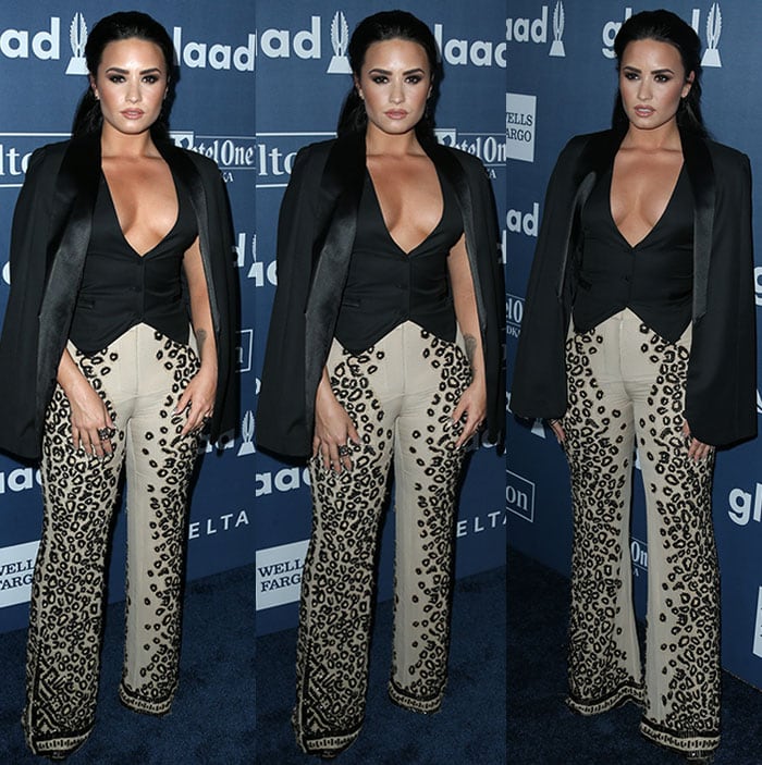 Demi Lovato in shows off her cleavage in a Sass & Bide ensemble