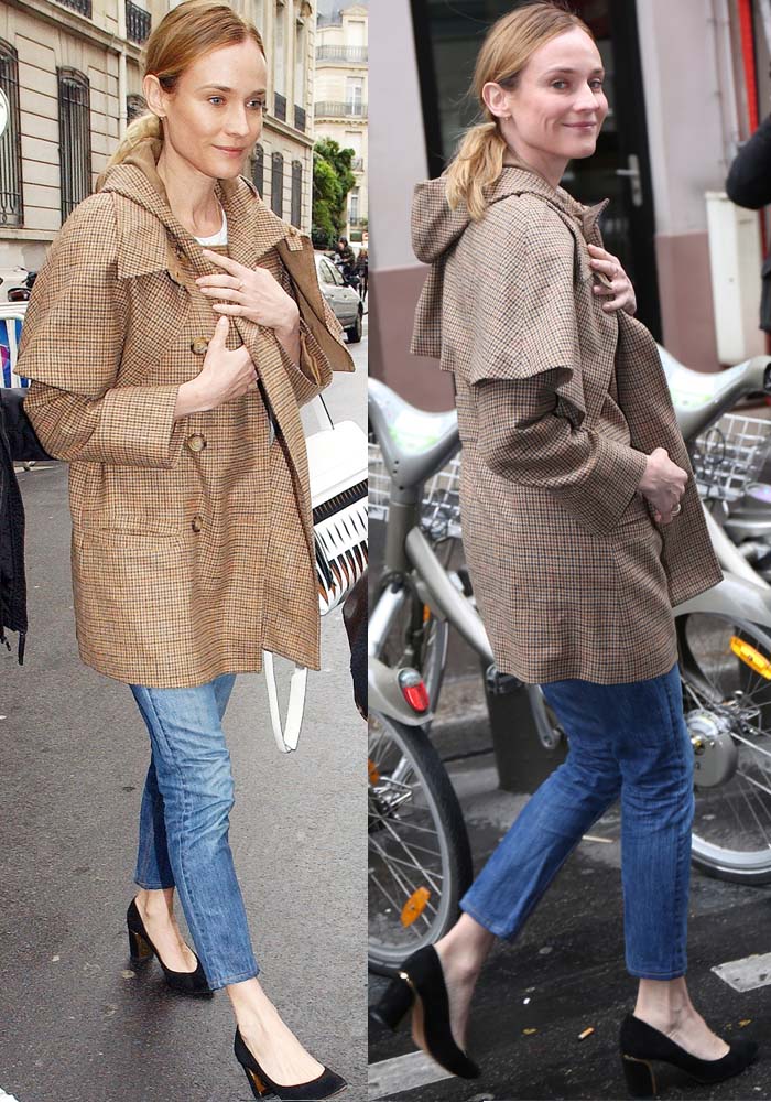 Diane Kruger pairs a checkered cape coat with a plain t-shirt and a pair of jeans